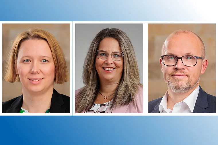 Drei Personen, zwei Frauen und ein Mann, vor neutralem Hintergrund, formell gekleidet